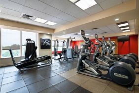 Radisson Hotel JFK Airport’s fitness room, equipped with assortment of exercise machines.