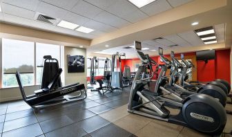 Radisson Hotel JFK Airport’s fitness room, equipped with assortment of exercise machines.