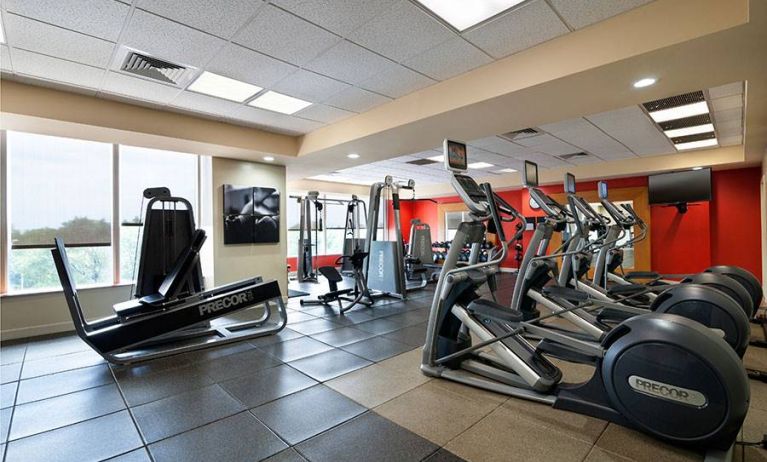 Radisson Hotel JFK Airport’s fitness room, equipped with assortment of exercise machines.