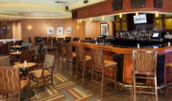 The hotel’s lounge bar, with tall bar chairs (and smaller tables and chairs).