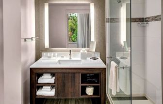 Private guest bathroom with shower at Residence Inn Miami Beach Surfside.