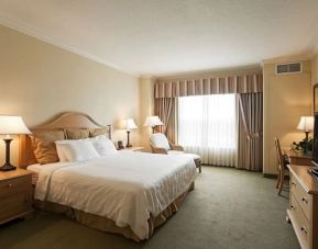 Spacious delux king room with work desk and TV at Monumental Hotel Orlando.