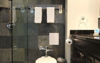 Private guest bathroom with shower at Ocean Manor Beach Resort.