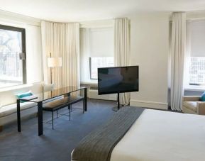 Spacious delux king room with TV and couch at The Ambassador Chicago.