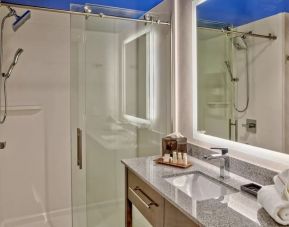 Private guest bathroom with shower at Hotel Indigo Pittsburgh University-Oakland.
