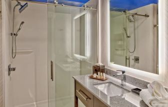 Private guest bathroom with shower at Hotel Indigo Pittsburgh University-Oakland.