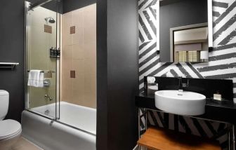 Guest bathroom with shower at Villa Florence Hotel.