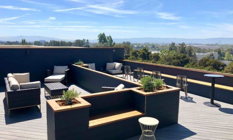 Rooftop outdoor furniture at Holiday Inn & Suites Silicon Valley - Milpitas.