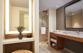 Private guest bathroom with shower at Naples Grande Beach Resort.