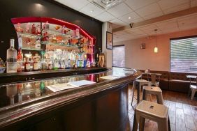 The hotel bar has bar stool seating and a range of liquid refreshments.