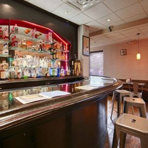 The hotel bar has bar stool seating and a range of liquid refreshments.