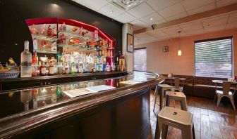 The hotel bar has bar stool seating and a range of liquid refreshments.