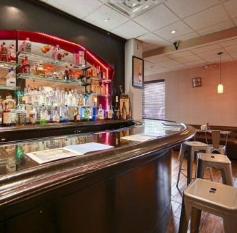 The hotel bar has bar stool seating and a range of liquid refreshments.