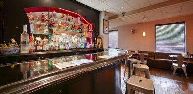 The hotel bar has bar stool seating and a range of liquid refreshments.