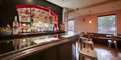 The hotel bar has bar stool seating and a range of liquid refreshments.