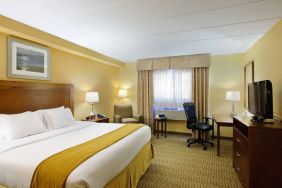 Guest room in Holiday Inn Express Philadelphia Airport, with double bed and chair/desk for working.