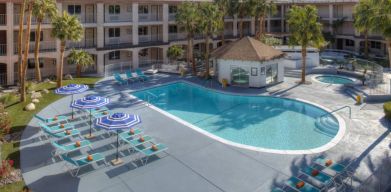 The hotel’s outdoor pool has plenty of loungers and trees nearby when you want a rest and some shade.