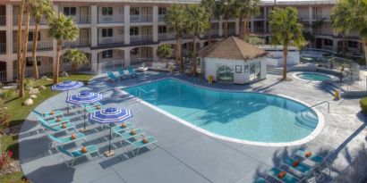 The hotel’s outdoor pool has plenty of loungers and trees nearby when you want a rest and some shade.