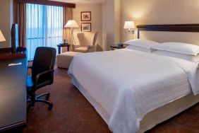 Sheraton Houston Brookhollow Hotel guest room with double bed and a workspace desk and chair.