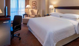 Sheraton Houston Brookhollow Hotel guest room with double bed and a workspace desk and chair.