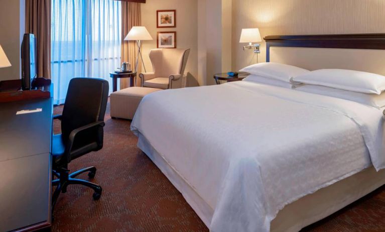 Sheraton Houston Brookhollow Hotel guest room with double bed and a workspace desk and chair.