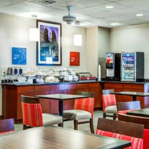 The Comfort Suites Lombard – Addison’s breakfast area has small tables and a hard floor.