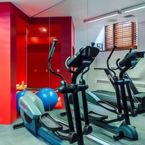 The hotel fitness center has both weights and exercise machines.