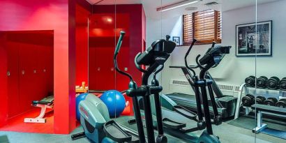 The hotel fitness center has both weights and exercise machines.