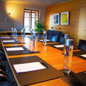 Meeting room in Hotel Gault, with long table and surrounding chairs.