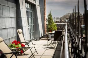 Many of the rooms in Hotel Gault have balconies with chairs and tables.