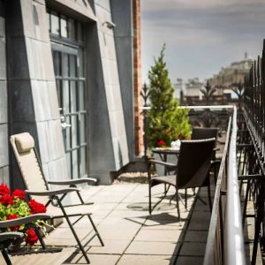 Many of the rooms in Hotel Gault have balconies with chairs and tables.