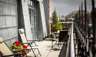 Many of the rooms in Hotel Gault have balconies with chairs and tables.