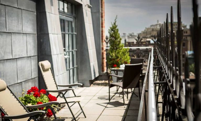 Many of the rooms in Hotel Gault have balconies with chairs and tables.