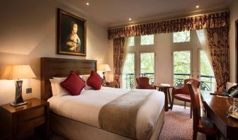 The Royal Horseguards Hotel’s garden view double room, with large windows for a verdant view.