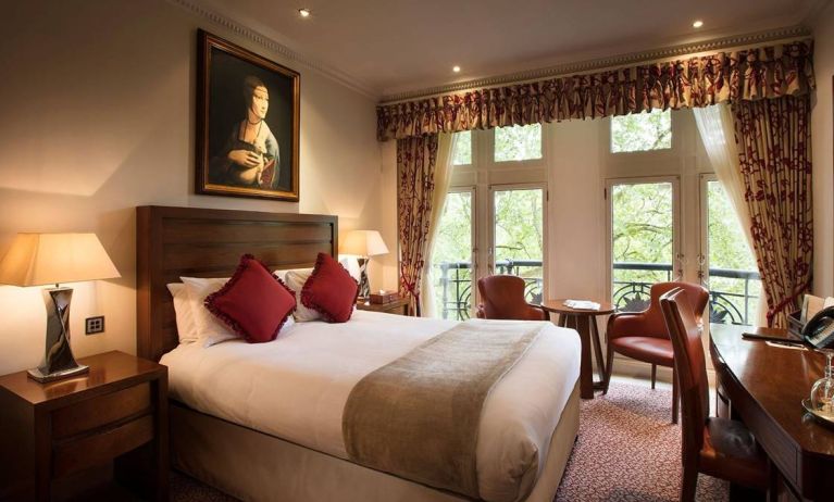 The Royal Horseguards Hotel’s garden view double room, with large windows for a verdant view.