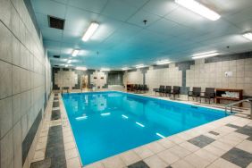 The hotel’s indoor pool has chairs and towels close at hand for swimmers.