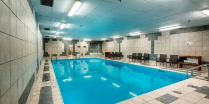 The hotel’s indoor pool has chairs and towels close at hand for swimmers.