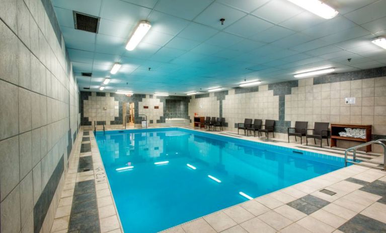 The hotel’s indoor pool has chairs and towels close at hand for swimmers.