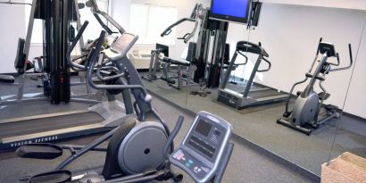 An assortment of exercise machines are accessible in the fitness center.