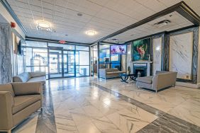 The Quality Inn Halifax Airport’s lobby has numerous comfy sofas, plus a widescreen TV and art on the walls.