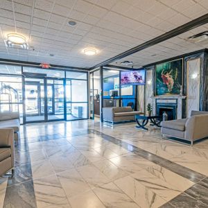 The Quality Inn Halifax Airport’s lobby has numerous comfy sofas, plus a widescreen TV and art on the walls.