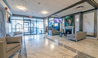 The Quality Inn Halifax Airport’s lobby has numerous comfy sofas, plus a widescreen TV and art on the walls.