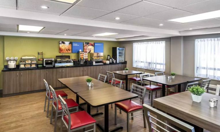 The hotel’s breakfast area has a hard floor and variety of table sizes for diners.