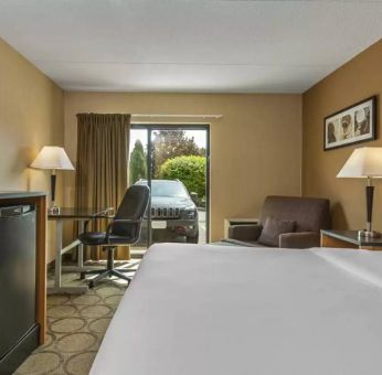 Guest room in Comfort Inn Edmonton West, with double bed and large window.