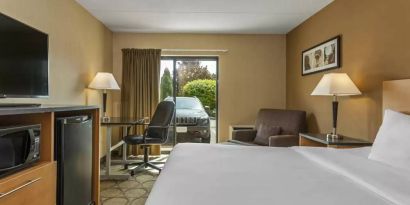 Guest room in Comfort Inn Edmonton West, with double bed and large window.