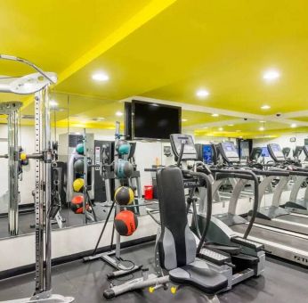 The hotel’s fitness room, furnished with a range of exercise machines.