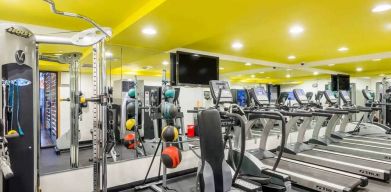 The hotel’s fitness room, furnished with a range of exercise machines.