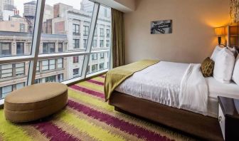 Floor-to-ceiling windows in a double bedroom at the Best Western Premier Herald Square.