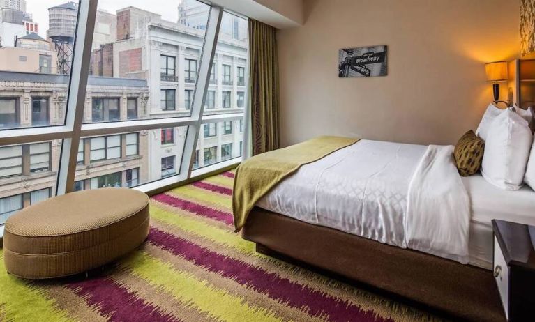 Floor-to-ceiling windows in a double bedroom at the Best Western Premier Herald Square.