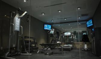 The hotel’s exercise room, with stacked weights and assorted fitness machines.